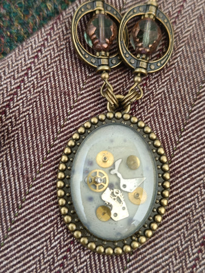 Collier chaîne et chapelet de perles pendentif ovale steampunk