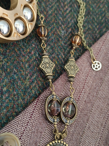 Collier chaîne et chapelet de perles pendentif ovale steampunk
