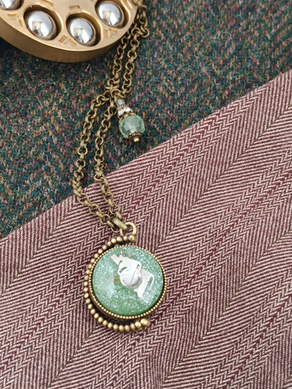 Collier sautoir chaîne steampunk pendentif mappemonde pivotant