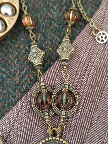 Collier chaîne et chapelet de perles pendentif ovale steampunk